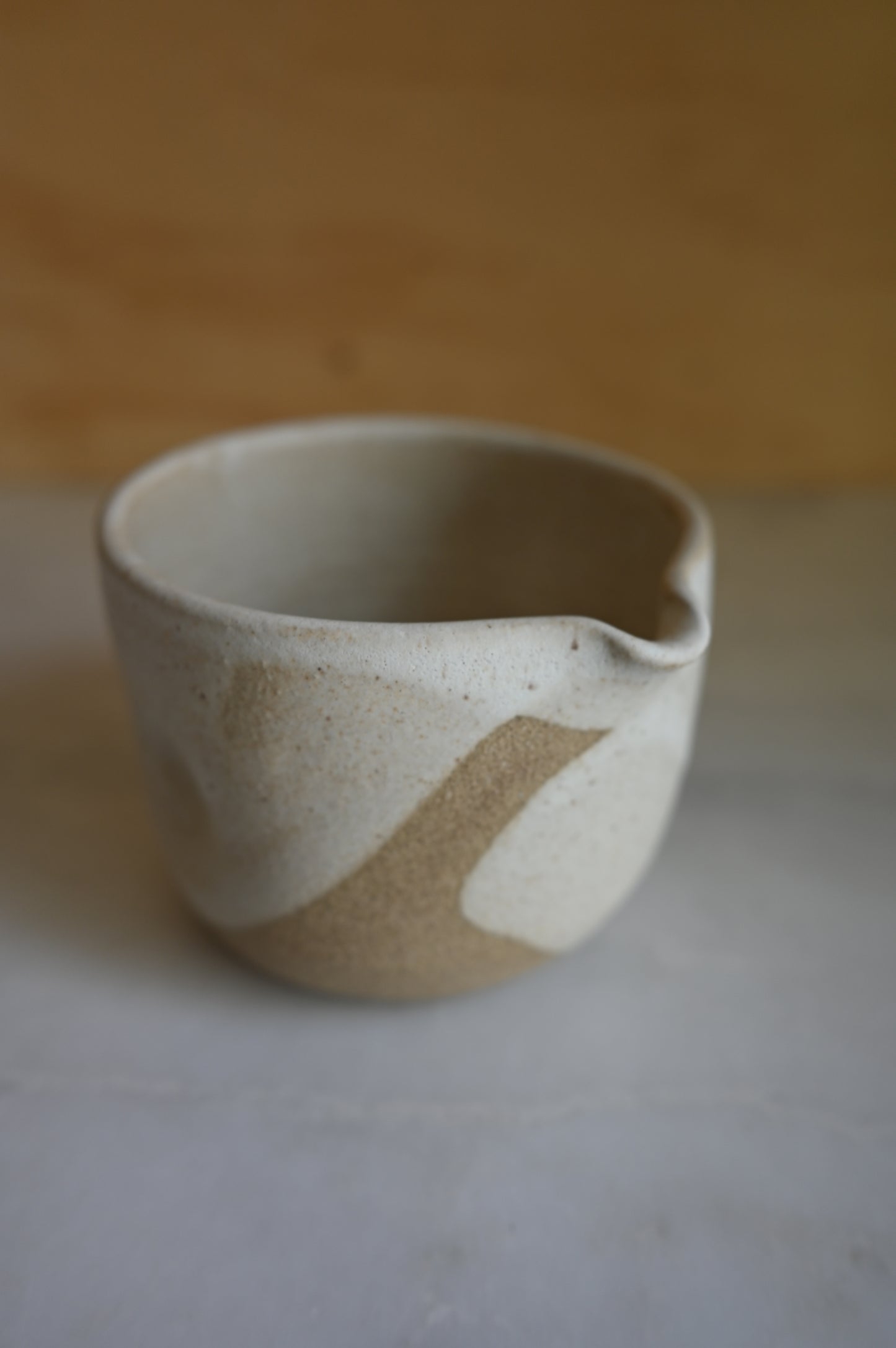 Macha bowl glazed in white sitting on counter